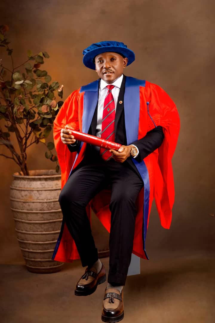 Ejike Dike in academic regalia